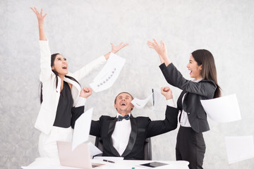 Celebrating success Cheerful young people looking excited. Successful entrepreneurs and business people achieving goals