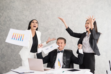 Celebrating success Cheerful young people looking excited. Successful entrepreneurs and business people achieving goals