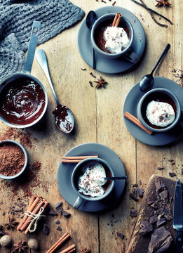 Cup of hot chocolate drink with whipped cream and cinnamon