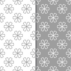White and gray floral backgrounds. Set of seamless patterns
