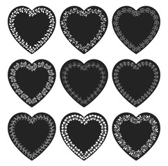 Vectors set with black heart shaped tags with white floral borders in chalkboard style for labels, tags and product packaging