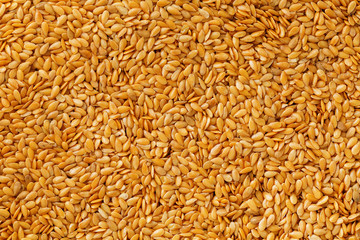 Background texture of white flax seeds. Useful cereals.