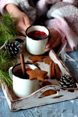 Cinnamon cookie with raspberry tea on christmas background 
