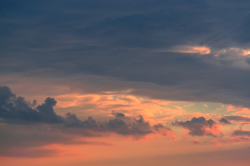Colorful clouds on dramatic sunset sky
