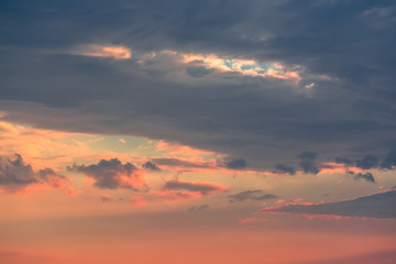 Colorful clouds on dramatic sunset sky