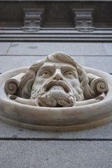 Face of a man on the wall of a public building in Madrid, Spain