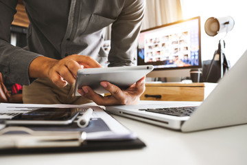 businesswoman hand using smart phone, tablet payments and holding credit card online shopping, omni channel, digital tablet docking keyboard computer at office in sun light