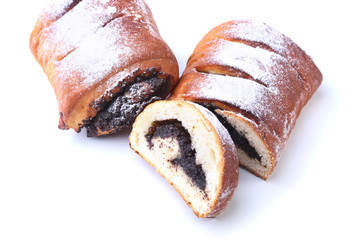 Poppy seed and walnut rolls, traditional Chistmas beigli cake isolated on white background.