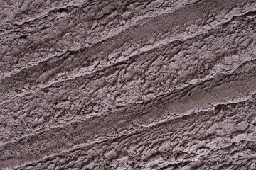 Cosmetic clay texture, background. Natural mask, dry black  clay for the face and body.