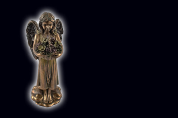 Angel statue stock images. Angel isolated on a black background. Angel figurine on a black background with copy space for text. Angel of Death stock images