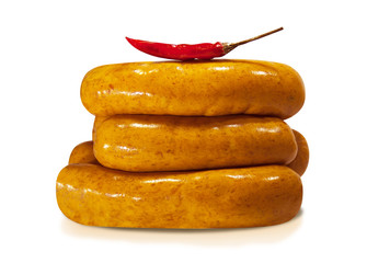 Raw German sausages with curry and Mexican red pepper isolated on white background. Sausages with...