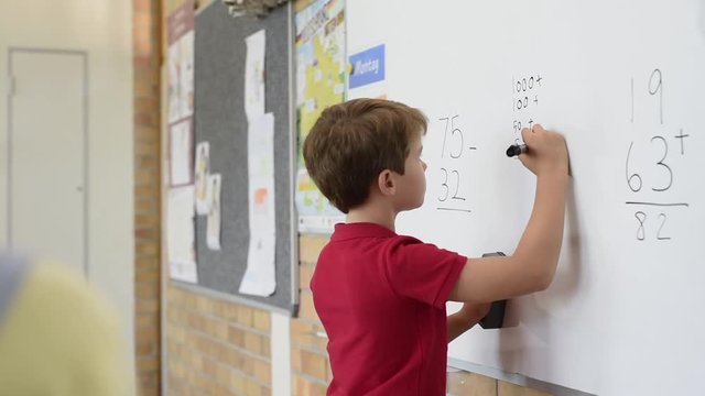 Boy solving math problem
