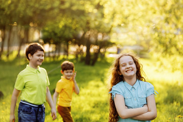 Fototapeta premium Cute children resting in summer park. Family, happy childhood concept.