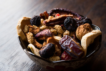 Dried Fruits; Apple, Apricot, Mulberry, Raisin, Fig, Cranberry, Raspberry and Date in Bowl.
