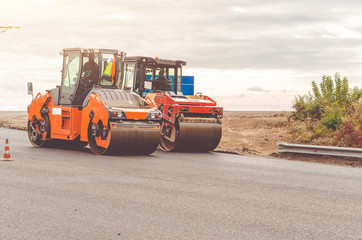 Road rollers, asphalt laying, road works