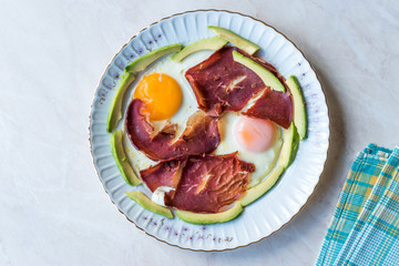 Fried Egg with Bacon Pastirma / Pastrami and Avocado Slices for Breakfast.