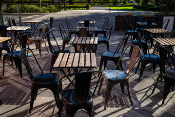 Empty chairs and tables outside a cafe in Southampton, England.
