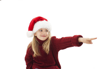 Fototapeta na wymiar Christmas little girl pointing at copy space. Isolated on white background 