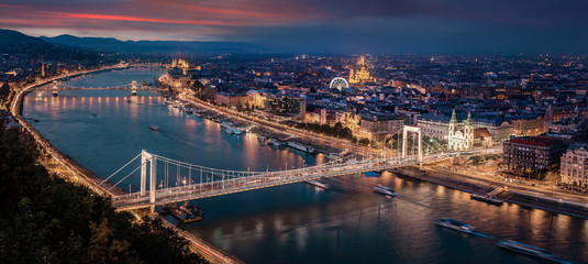 Obraz na płótnie Canvas Budapest, Hungary - Aerial panoramic skyline of Budapest at sunset. This view includes Elisabeth Bridge (Erzsebet Hid), Parliament, Szechenyi Chain Bridge, St. Stephen's Basilica and other landmarks