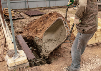 Concrete in a wheelbarrow at a construction site