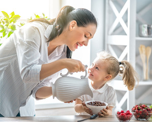 Happy family having breakfast.