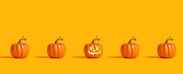 Fototapeten Halloween orange pumpkins on an orange background © Tierney
