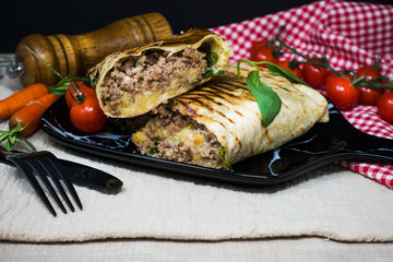 beef tacos served with lettuce and fresh tomatoes
