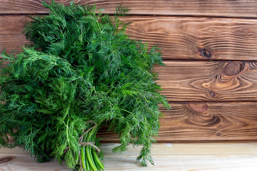 fresh green vitamin Dill on the Brown boards