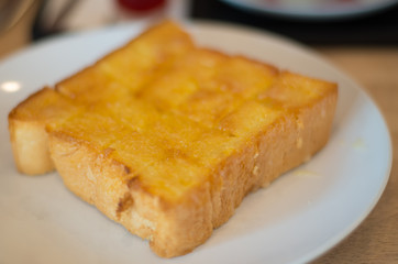 Bread on white plate.
