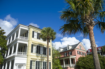 Fototapeta na wymiar Colorful classical Southern architecture of the Battery neighborhood with palmetto palms in Charleston, South Carolina