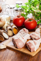 Raw chicken legs with spices