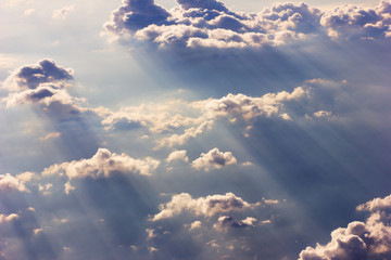 Background blue sky with a cloud behind the airplane window