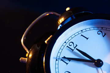 Five minutes to midnight on retro analog clock