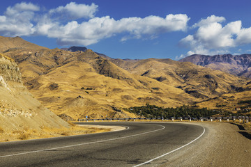 The road in the mountains of Armenia on a sunny summer day