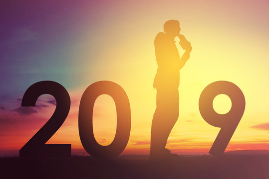 2019 happy new years christmas eve, Silhouette of a man is standing on thinking idea of new projects in outdoor
