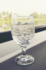 Ice drinking water in glass