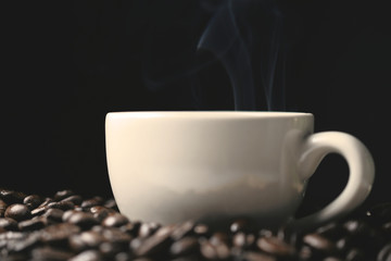 Coffee beans and coffee cup with smoke