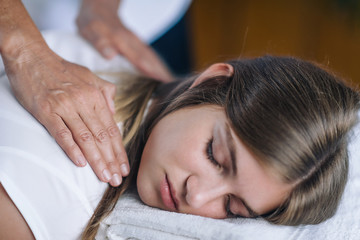 Obraz na płótnie Canvas Reiki Shoulders Massage With Peaceful Teenage Girl