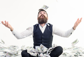 Happy man celebrates success under money rain. Falling down dollar banknotes. Financial freedom,...
