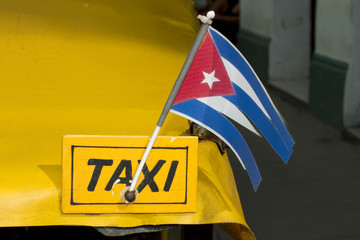 Cuban Taxi With The National Flag Of Cuba