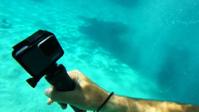 POV, jumping off boat in Tahiti