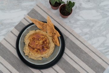 A bowl of hummus.