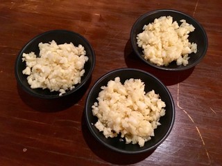 finely chopped garlic in many black bowls : An popular ingredient to use for any food, it's spicy when raw, it's Very pleasant aroma when cooking