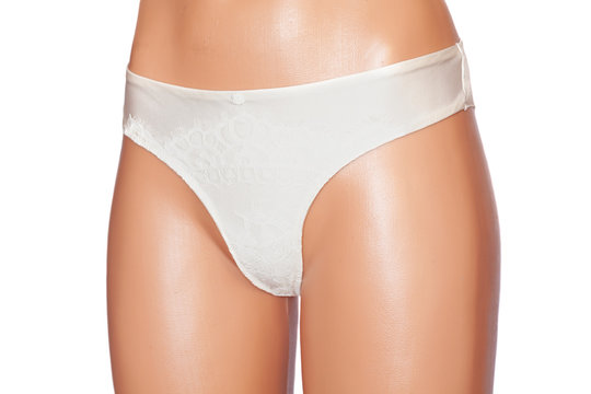 Female erotic panties on mannequin isolated on white background. White underwear closeup.