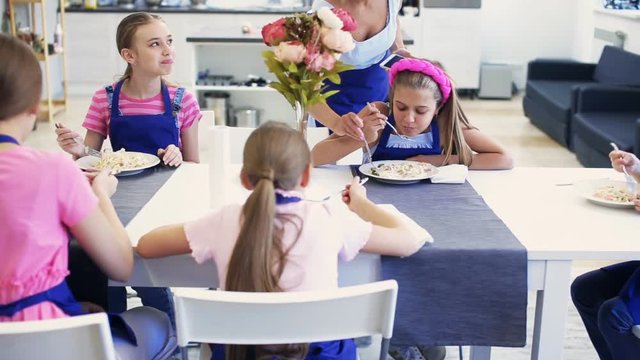 big family eating at the same table