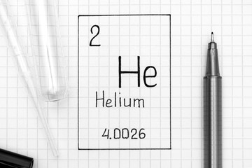 Handwriting chemical element Helium He with black pen, test tube and pipette.