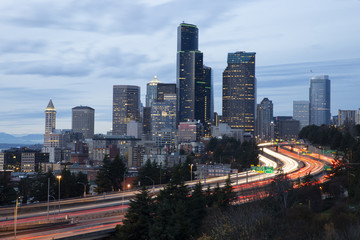 Long exposure of Seattle skyline and highway with Traffic at Sunset Dusk
