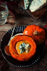 Pumpkin and pear soup with blue cheese.style rustic