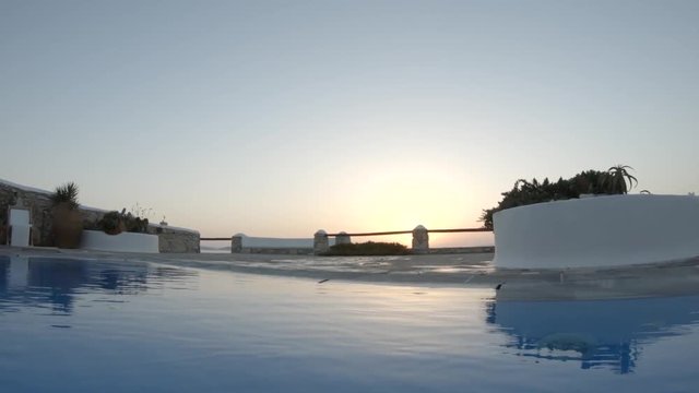 Resort pool at sunset, Greece