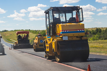 paver machine working on road repair